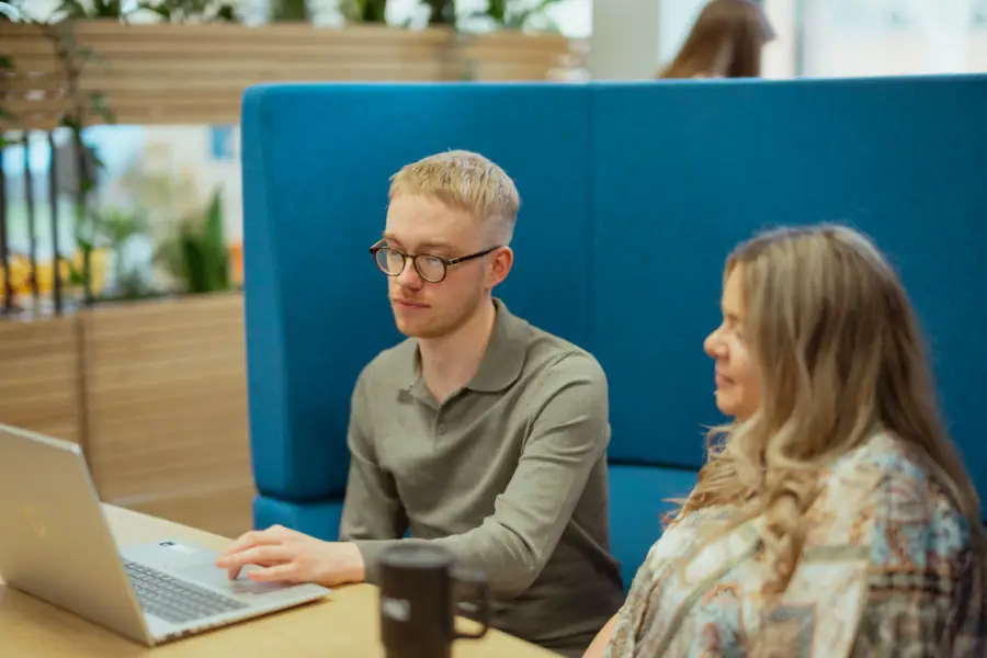 Colleagues in meeting booth