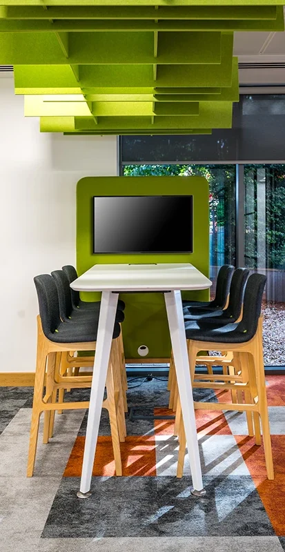 Meeting area with TV and acoustic ceiling
